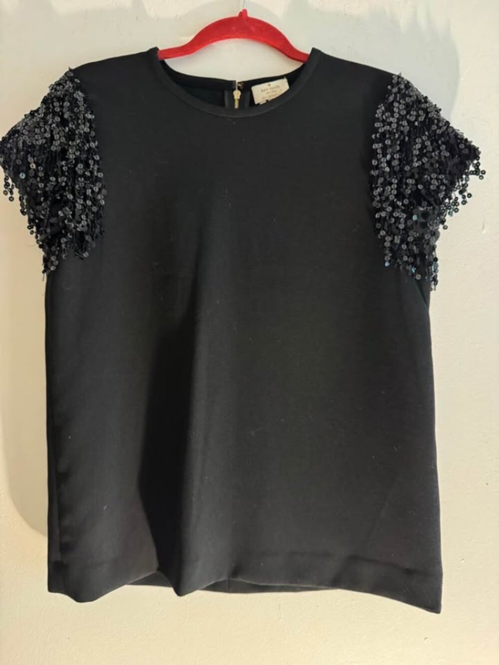 Kate Spade women black top featuring sequined detailing on the sleeves size 4